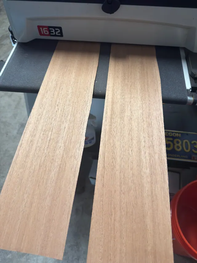Two mahogany plates coming off the drum sander