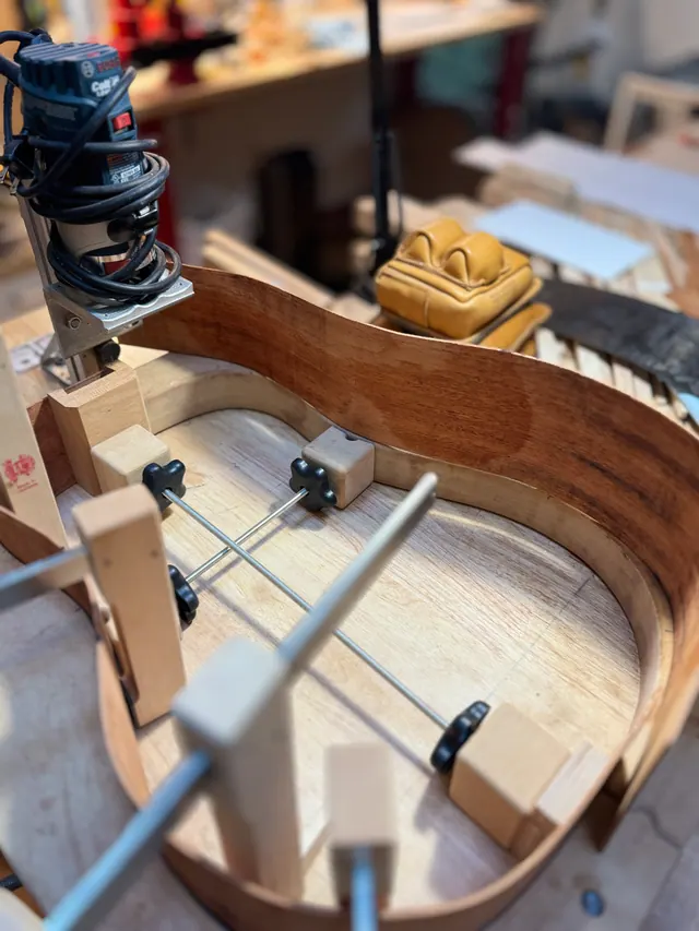 A laminate trimmer cutting the binding channel around a rim