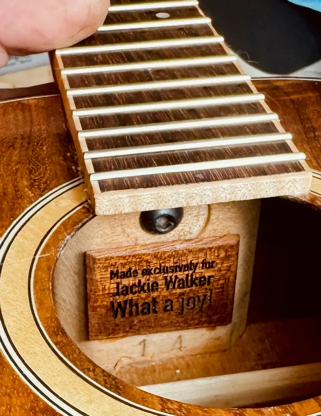 A branded label inside a build reading "Made exclusively for Jackie Walker — What a joy!"