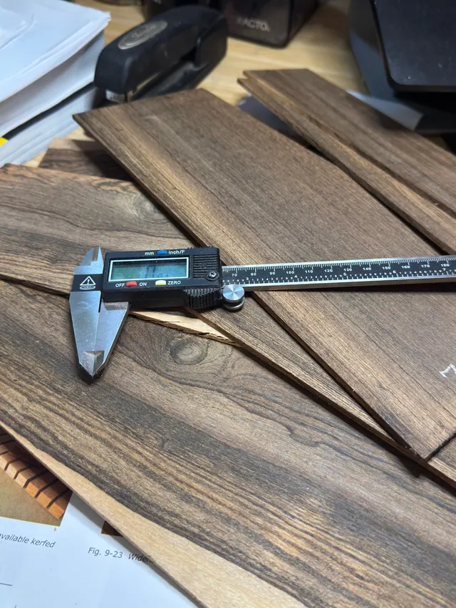 Digital calipers checking the thickness of rosewood sides