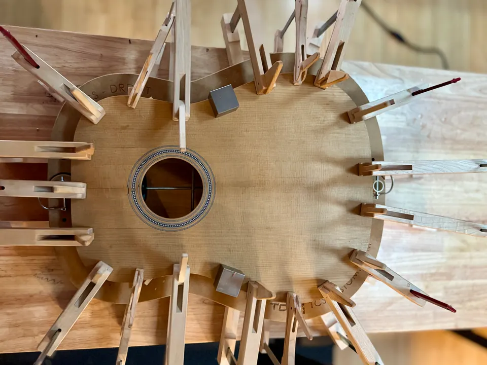 Guitar body under clamps during a careful glue-up