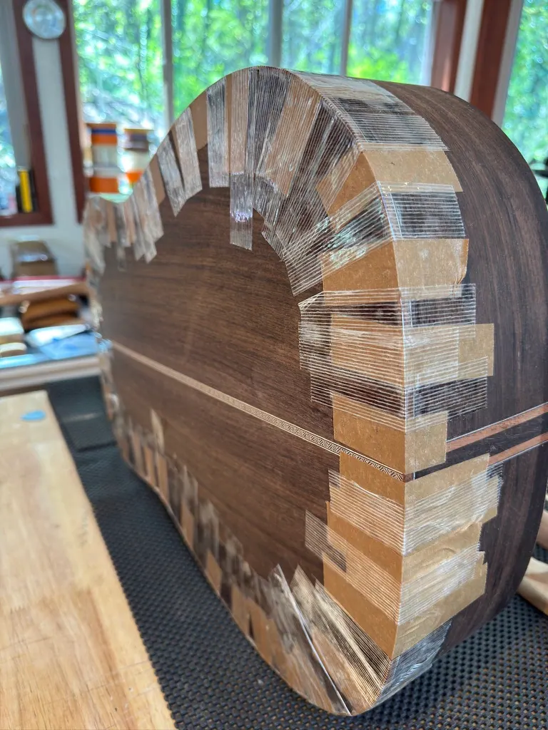 Honduran mahogany body with kerfing taped while glue sets