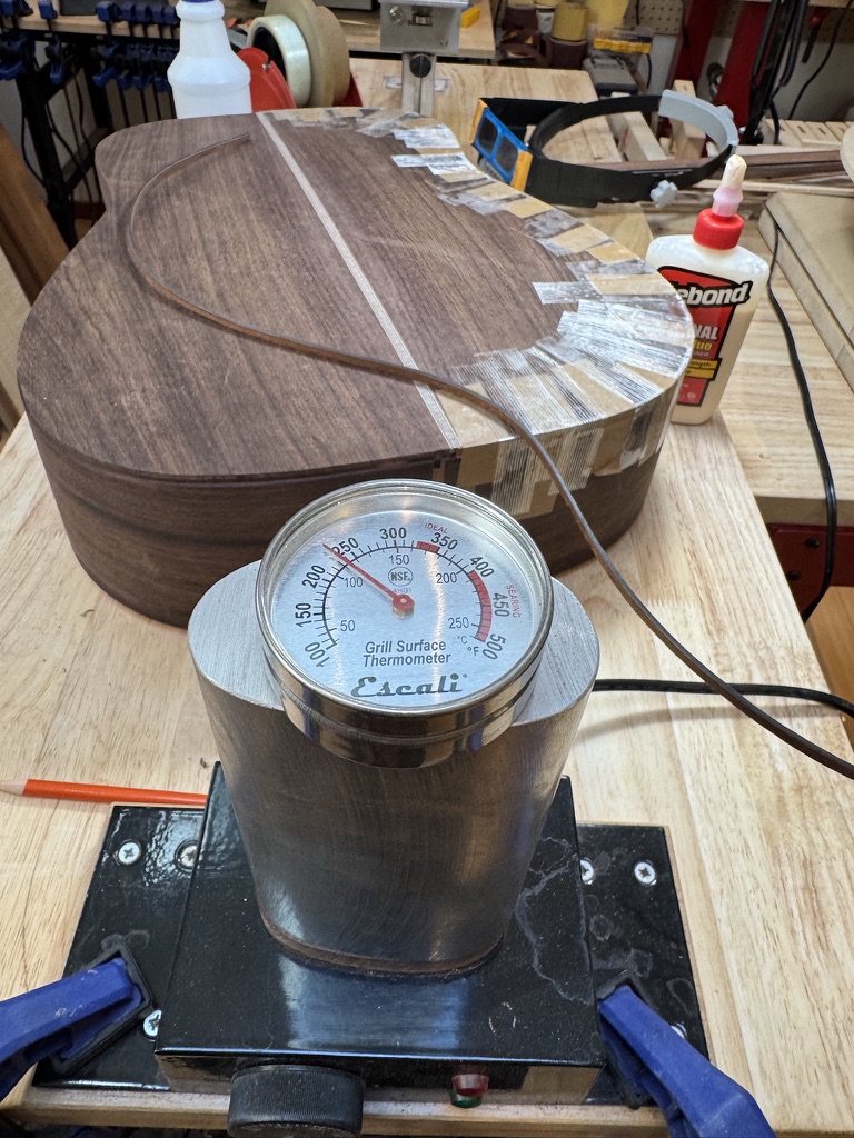 Bending walnut sides on the hot pipe, grill thermometer reading temperature